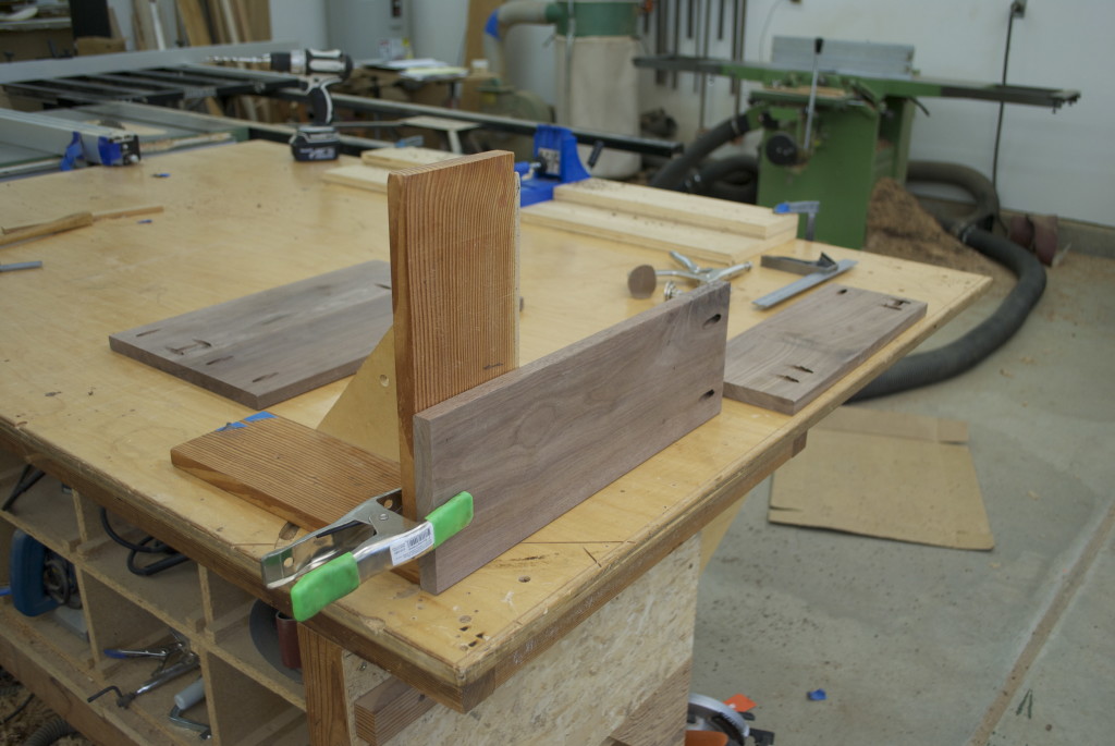 The RA jig holds a piece upright so that the mating piece can be face clamped to it.